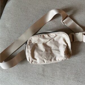 Lightly used cream belt bag